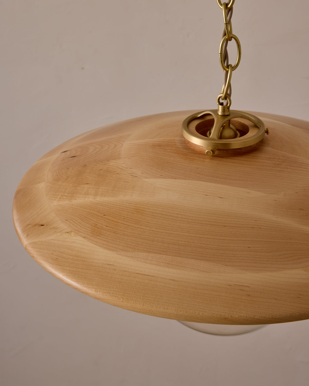 Large pendant light with oversized clear glass globe and decorative wooden clear maple shade with brass chain #shade-finish_natural maple #globe_clear glass #cord-color_beige
