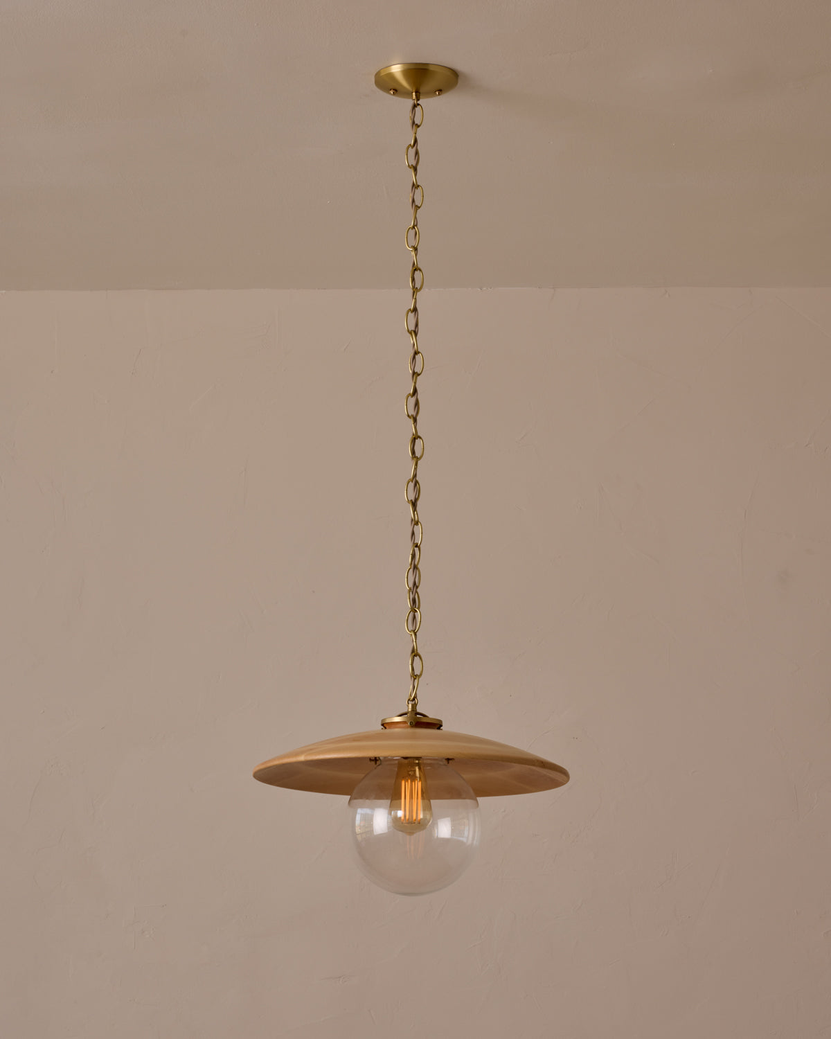 Large pendant light with oversized clear glass globe and decorative wooden clear maple shade with brass chain #shade-finish_natural maple #globe_clear glass #cord-color_beige
