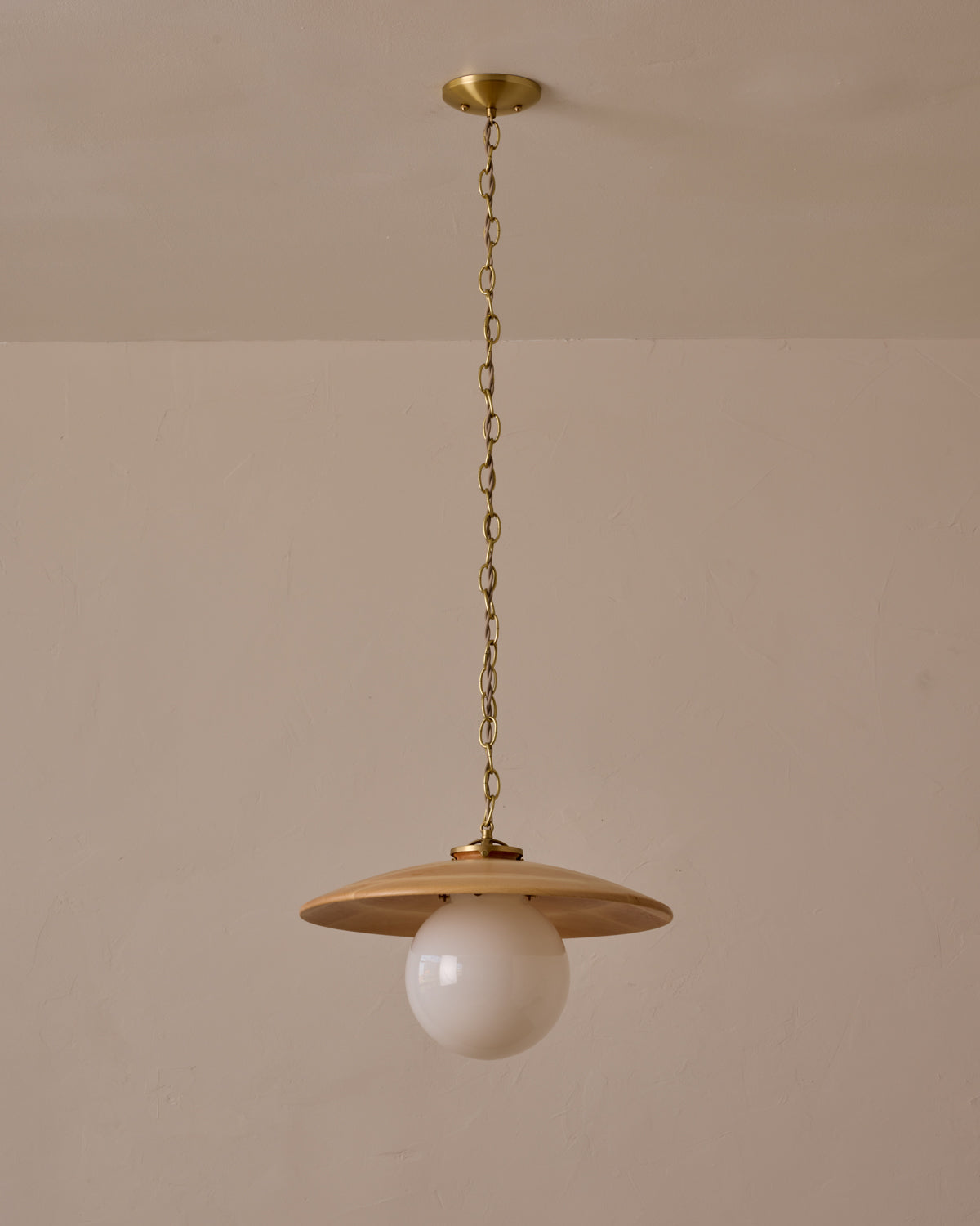 Large pendant light with oversized clear glass globe and decorative wooden clear maple shade with brass chain #shade-finish_natural maple #globe_white glass #cord-color_beige