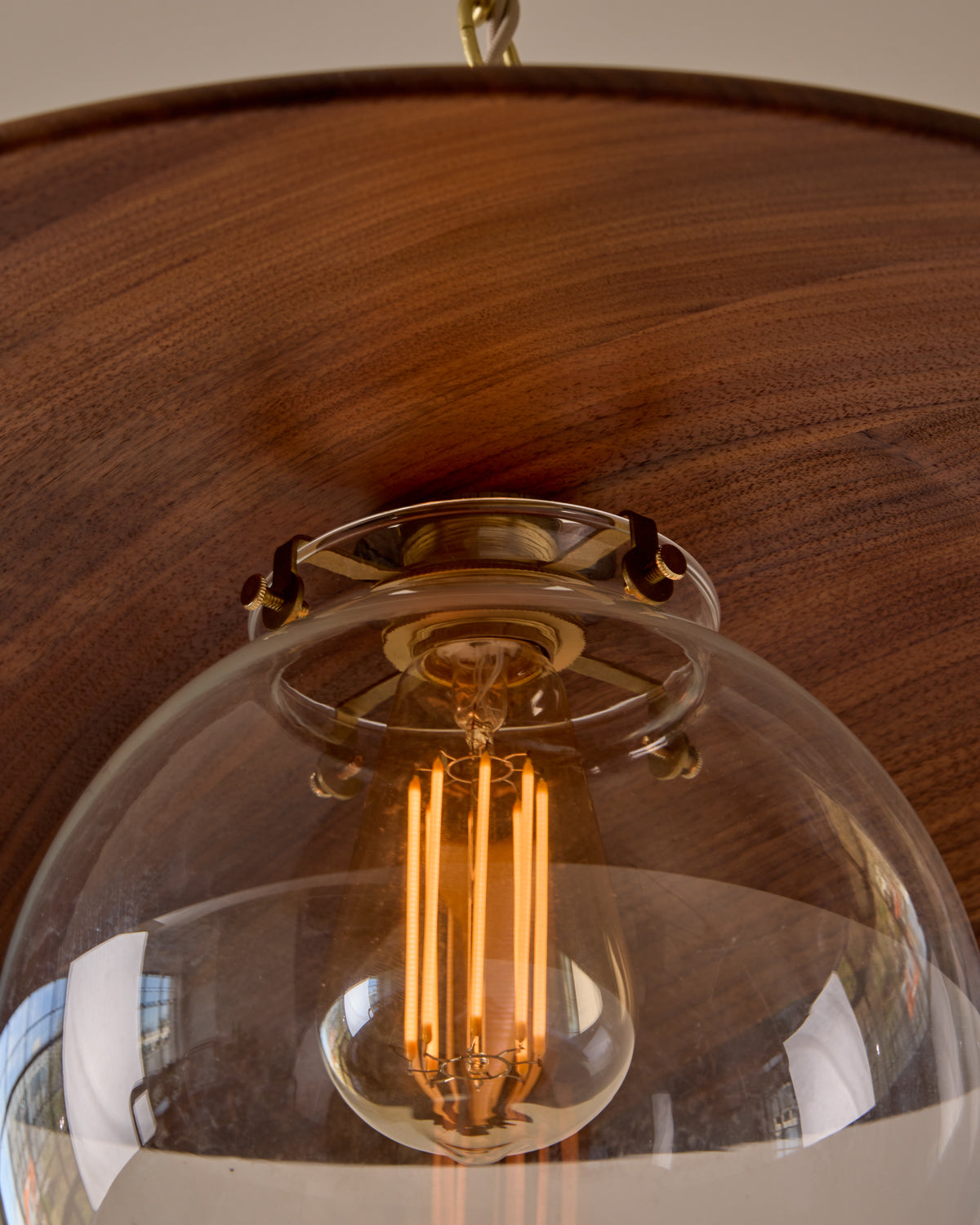 Large pendant light with oversized clear glass globe and decorative wooden clear maple shade with brass chain #shade-finish_black walnut #globe_clear glass #cord-color_beige