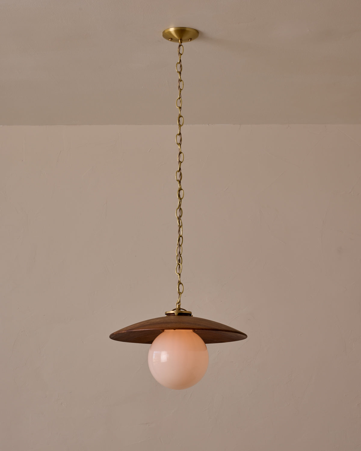 Large pendant light with oversized clear glass globe and decorative wooden clear maple shade with brass chain #shade-finish_black walnut #globe_white glass #cord-color_beige