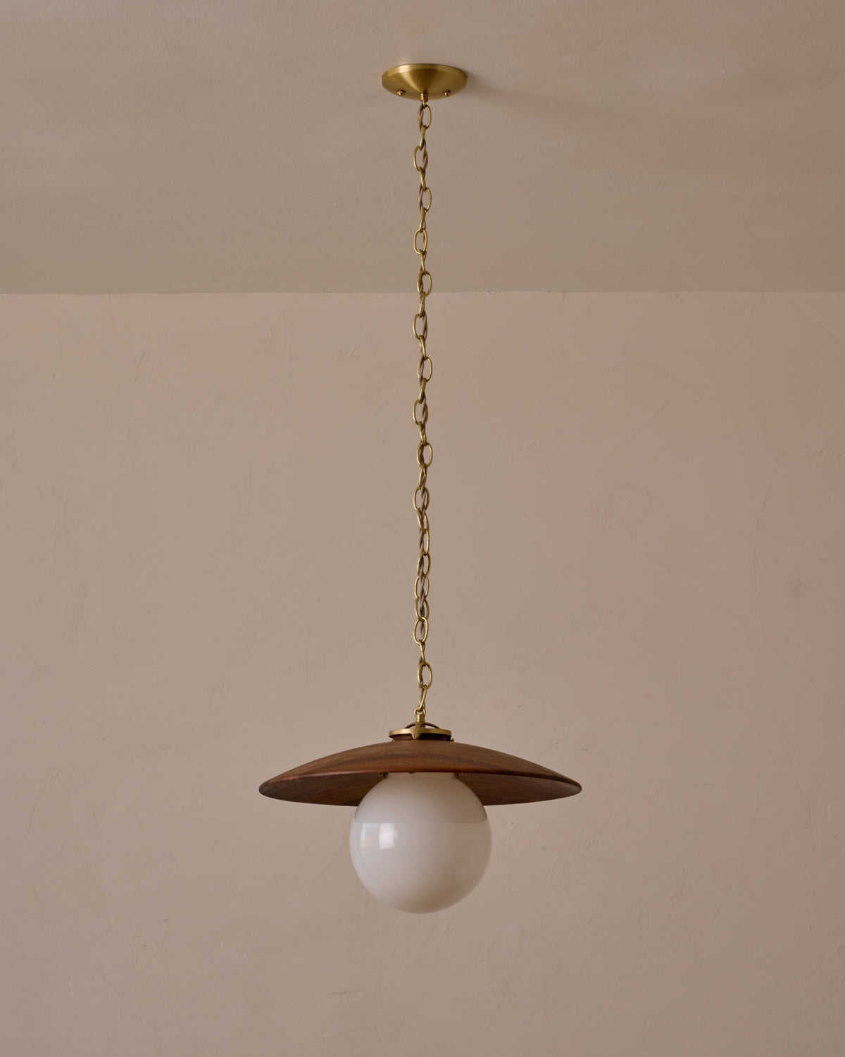 Large pendant light with oversized clear glass globe and decorative wooden clear maple shade with brass chain #shade-finish_black walnut #globe_white glass #cord-color_beige