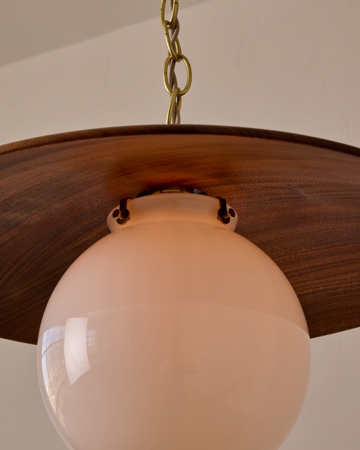 Large pendant light with oversized clear glass globe and decorative wooden clear maple shade with brass chain #shade-finish_black walnut #globe_white glass #cord-color_beige