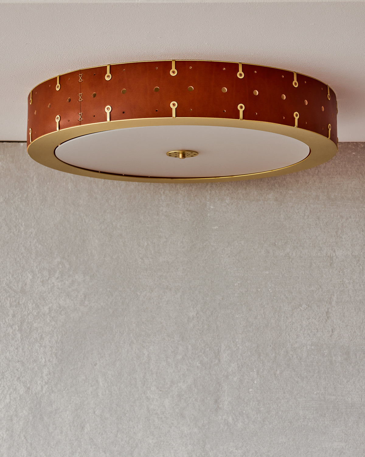 Beautiful satin brass flush mount ceiling fixture with handstitched leather drum shade #leather-finish_tan harness #size_24" drum