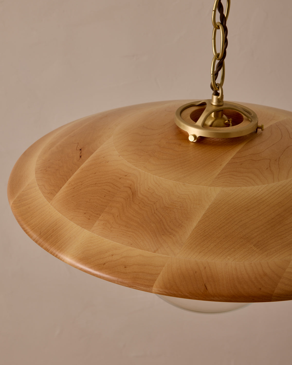 Large pendant light with oversized clear glass globe and decorative wooden clear maple shade with brass chain #shade-finish_natural maple #globe_clear glass #cord-color_brown