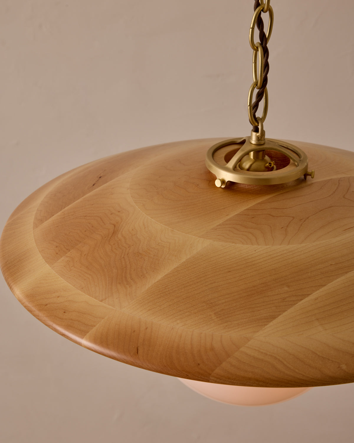 Large pendant light with oversized clear glass globe and decorative wooden clear maple shade with brass chain #shade-finish_natural maple #globe_white glass #cord-color_brown