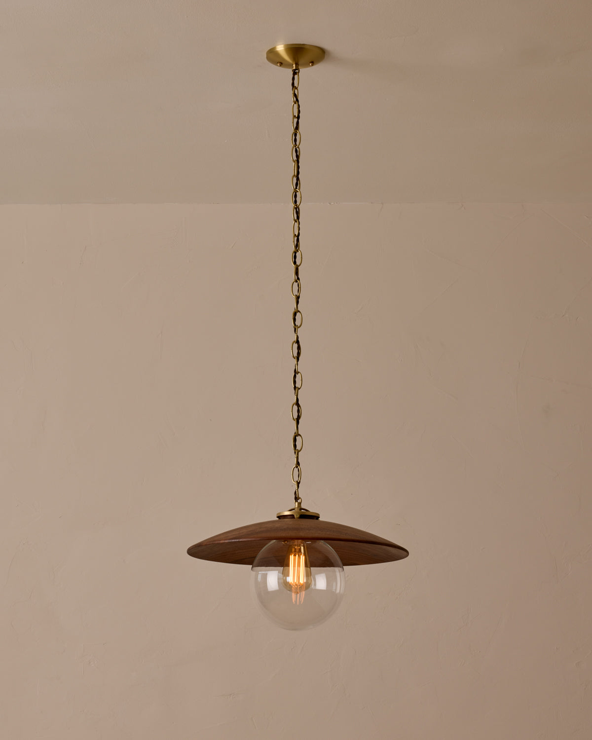 Large pendant light with oversized clear glass globe and decorative wooden clear maple shade with brass chain #shade-finish_black walnut #globe_clear glass #cord-color_brown