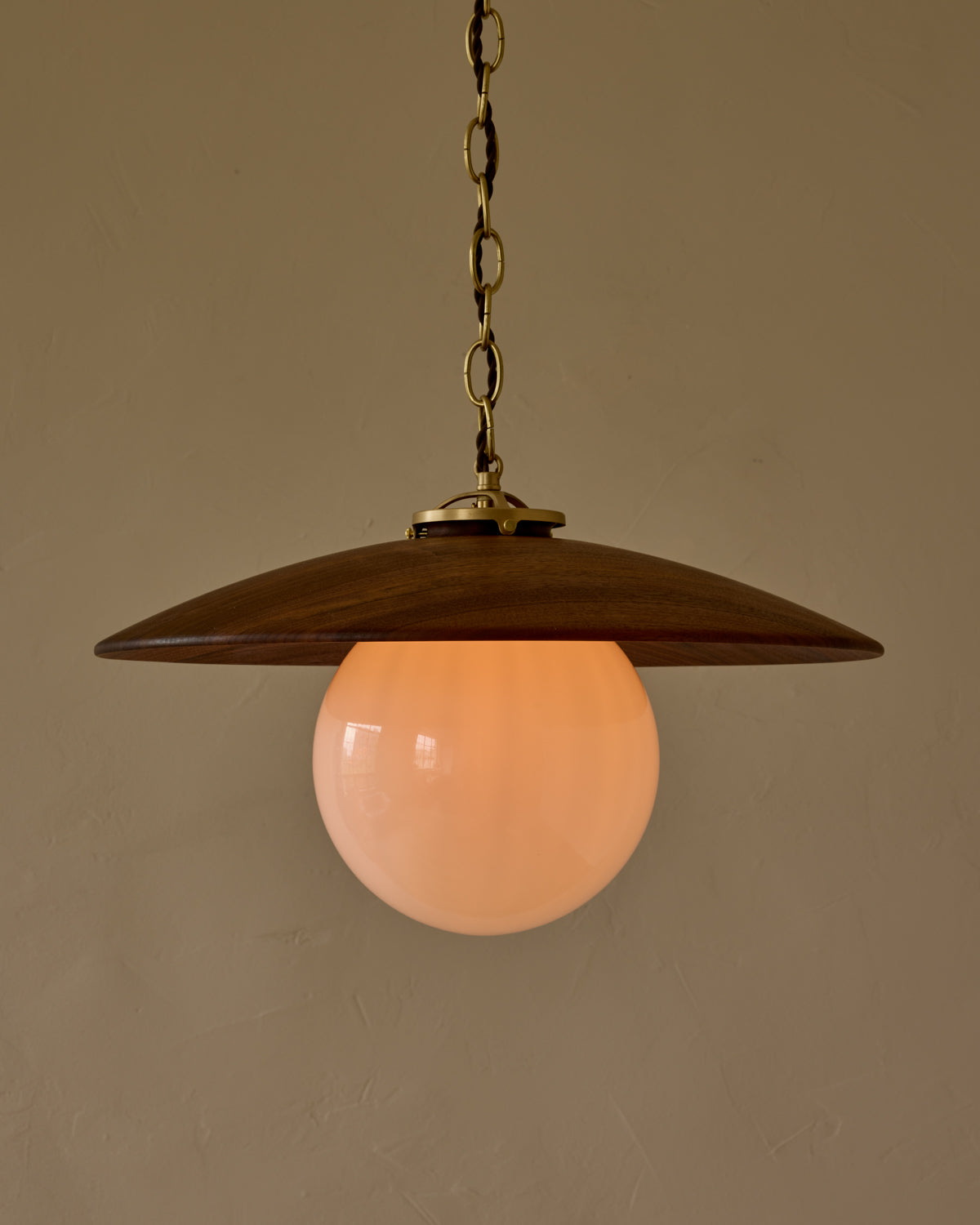 Large pendant light with oversized clear glass globe and decorative wooden clear maple shade with brass chain #shade-finish_black walnut #globe_white glass #cord-color_brown