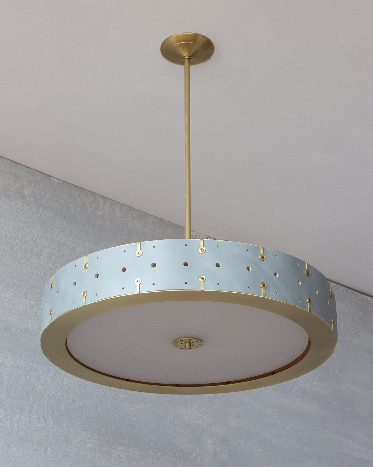 Beautiful satin brass ceiling pendant fixture with handstitched leather drum shade and customizable drop
#leather-color_cloud-blue