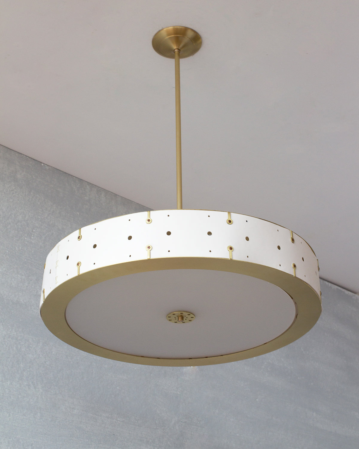 Beautiful satin brass ceiling pendant fixture with handstitched leather drum shade and customizable drop
#leather-color_dogwood