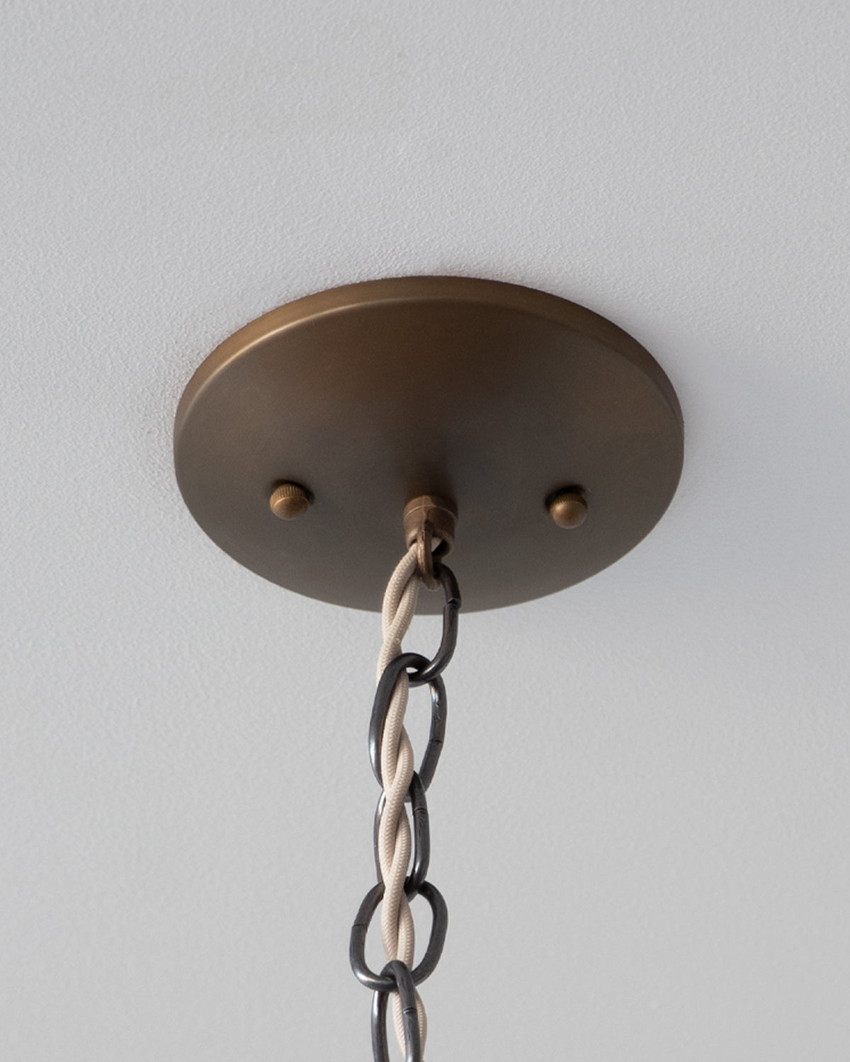 Modern mirrored cone pendants with oil rubbed brass. Hardwired light fixture. Simple interior design, made in the USA. #size_18" cone
