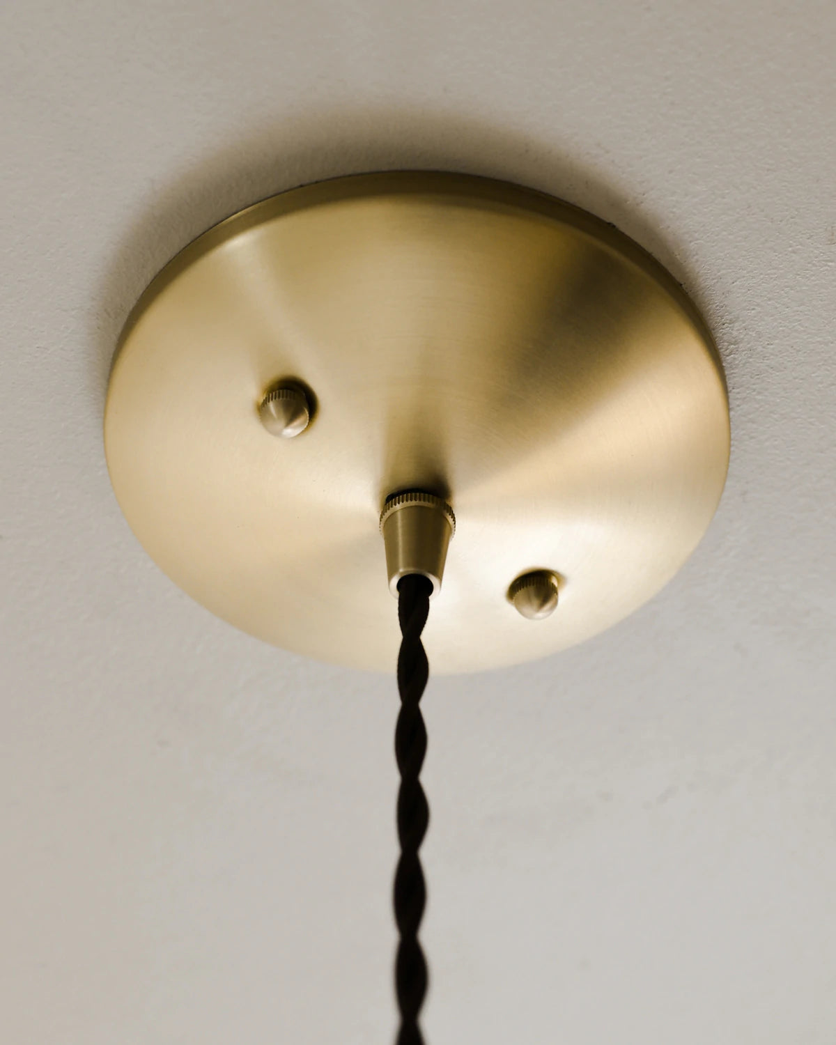 Small Pendant light with clear glass globe and decorative matte black ceramic shade