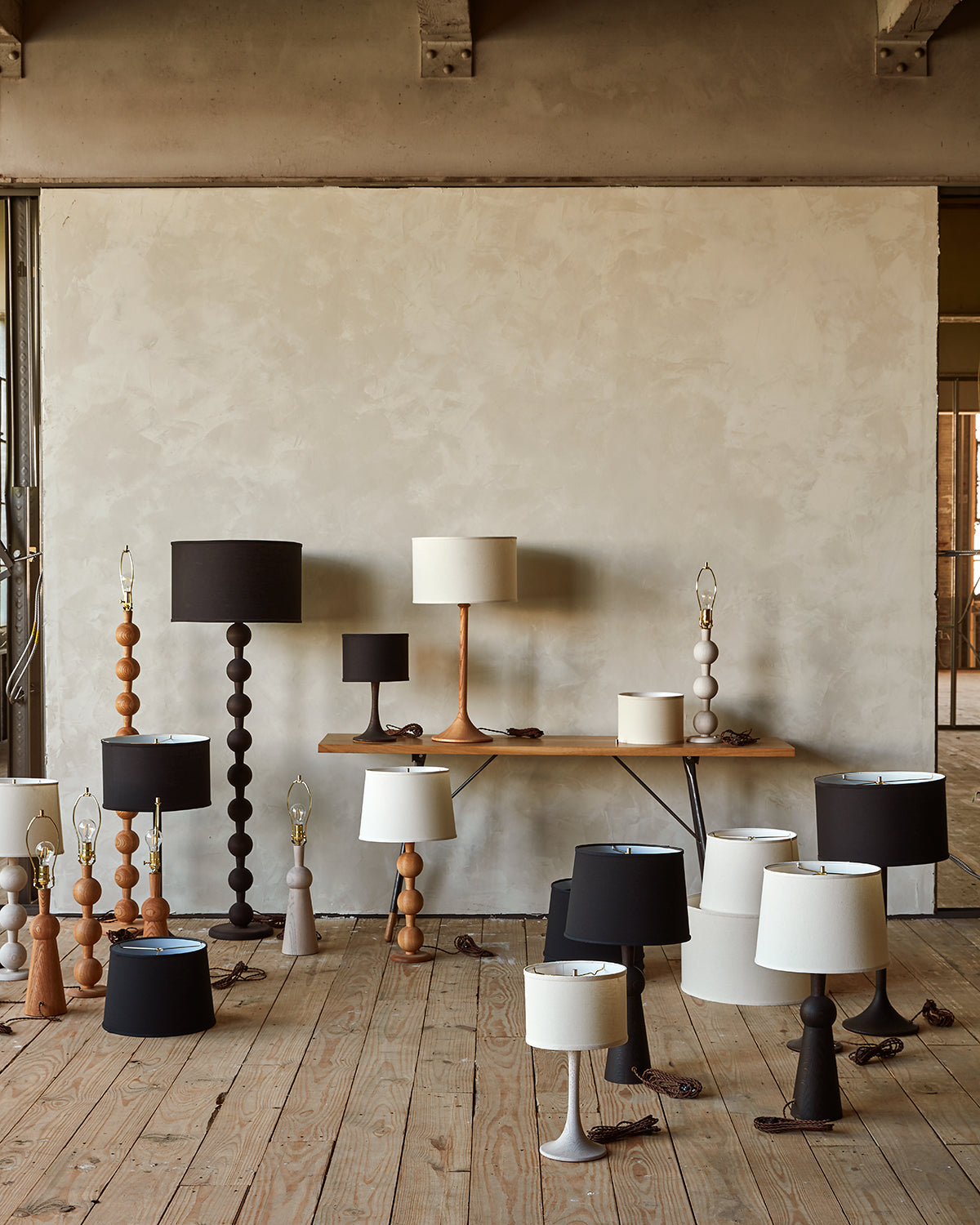 Collection of Lostine wood turned lamps in natural red oak, white wash, and dark wash finishes