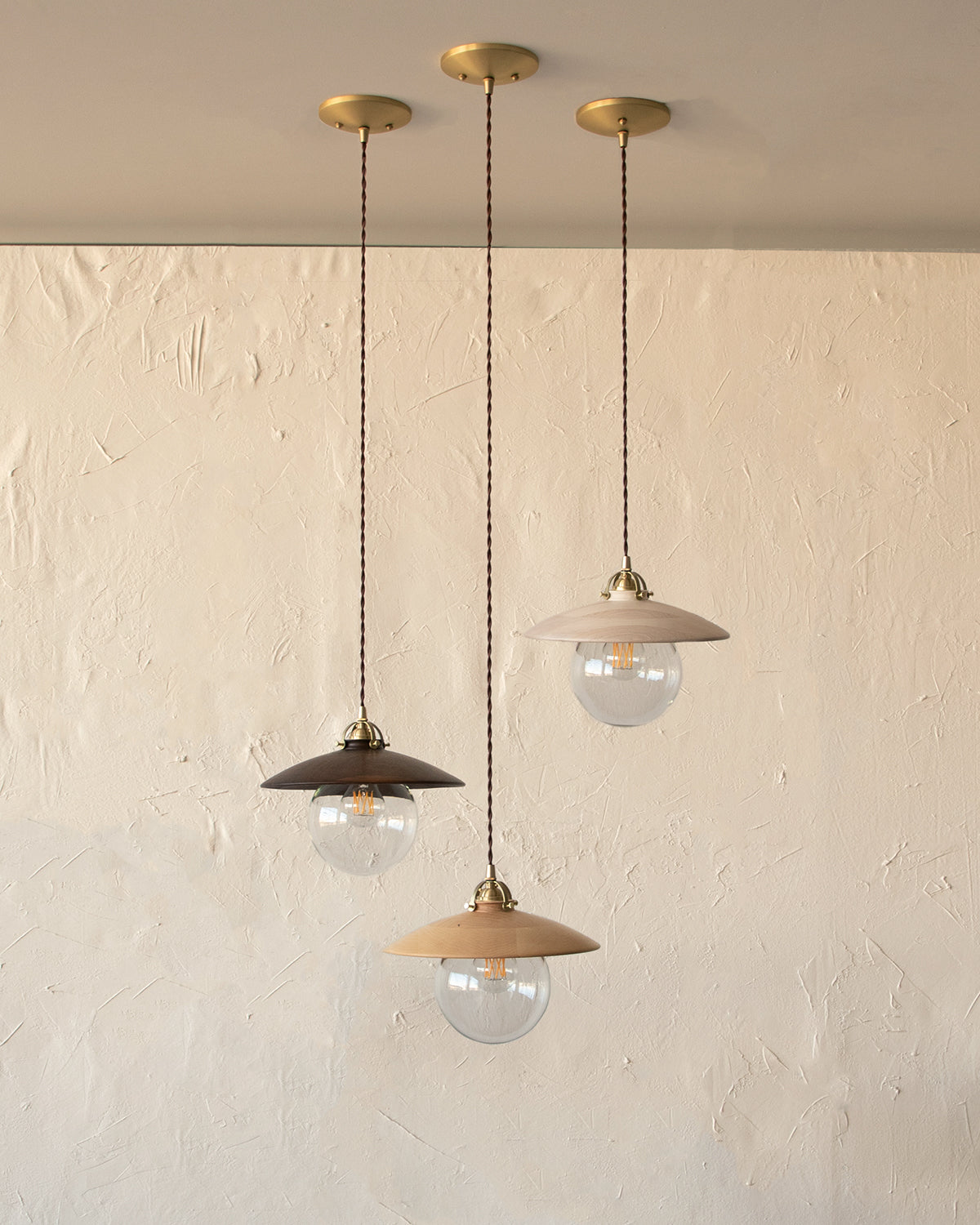 Pendant light with large clear glass globe and decorative wooden black walnut shade. Hardwired or plug light fixture. Made by Lostine in Philadelphia. Simple interior design, made in the USA. Warm American Modern Design
