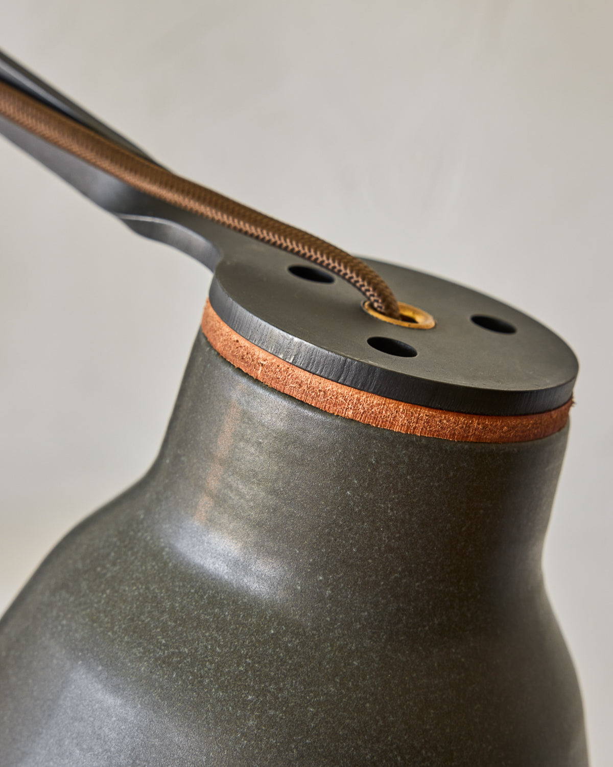 Maple, steel and ceramic wall sconce with articulating arm with matte black stoneware shade #color_almost black