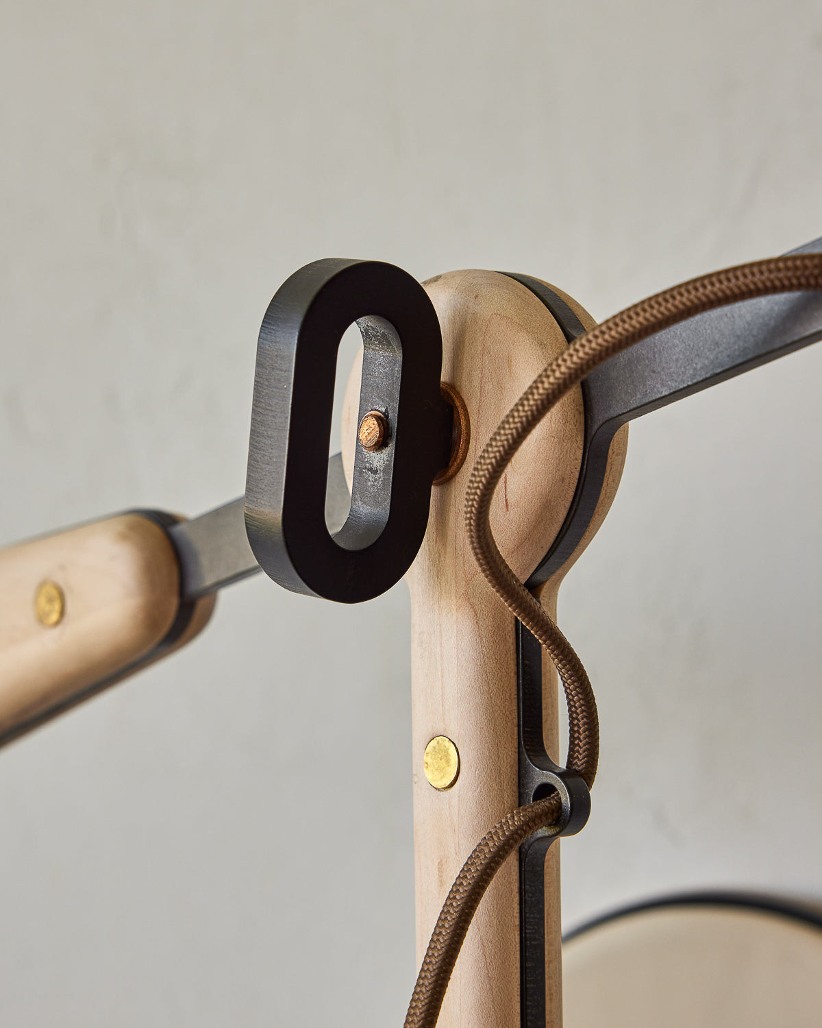 Maple, steel and ceramic wall sconce with articulating arm with glossy white stoneware shade and backplate #color_cream
