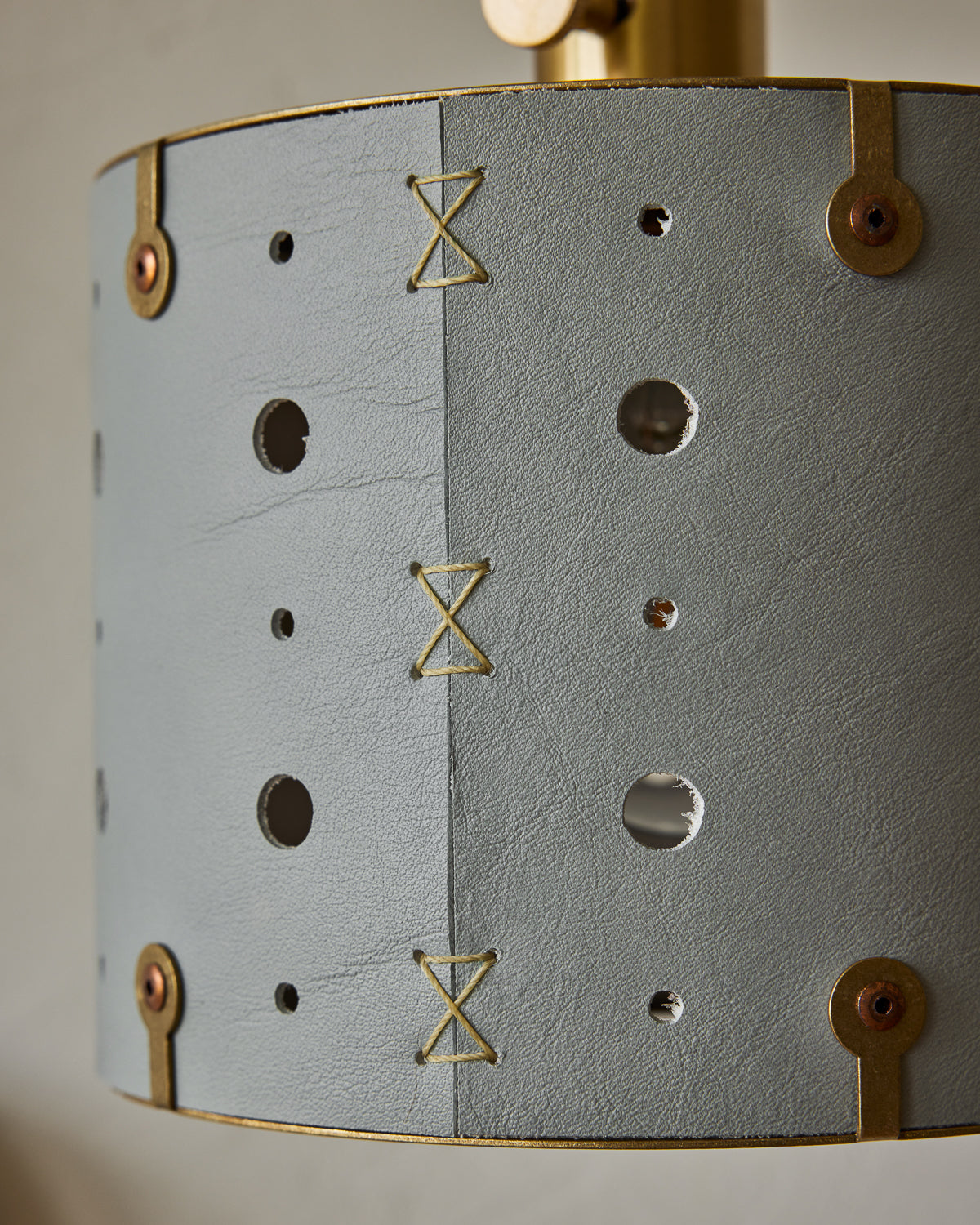 Articulating satin brass sconce with blue handstitched shade and walnut backplate #leather-finish_cloud blue