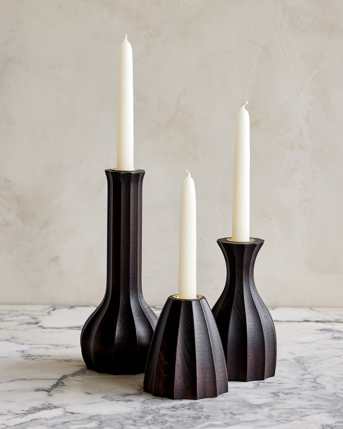 Trio of dark wash maple wooden candle holders with delicate grooves