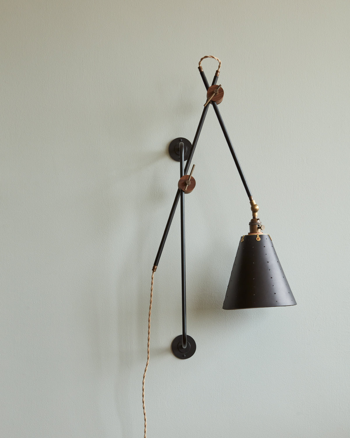 Large articulating black plug in wall sconce with black handstitched cone leather shade #shade-finish_black harness #wiring_plug-in
