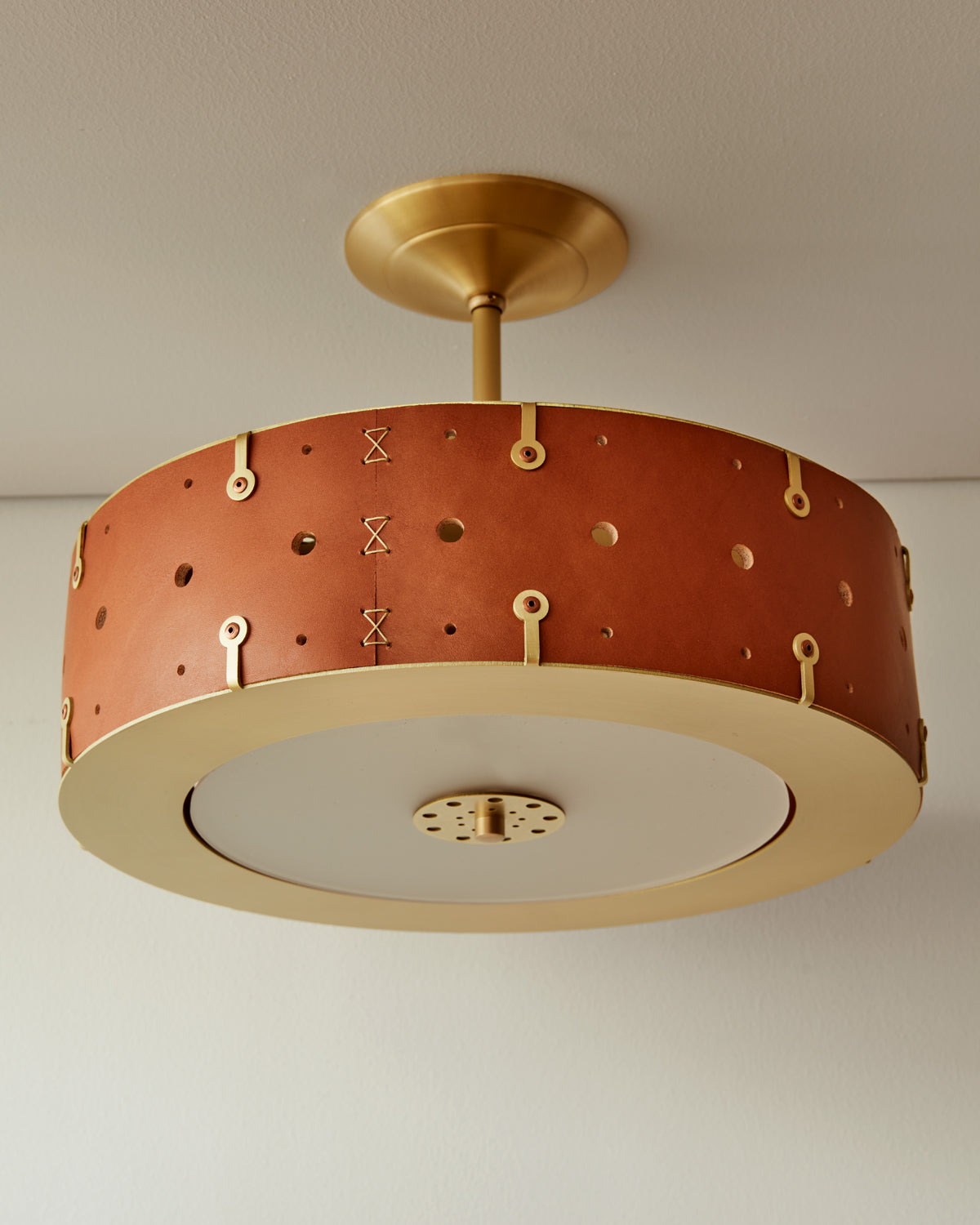 Beautiful satin brass ceiling pendant fixture with handstitched leather drum shade and customizable drop
#leather-color_tan-harness