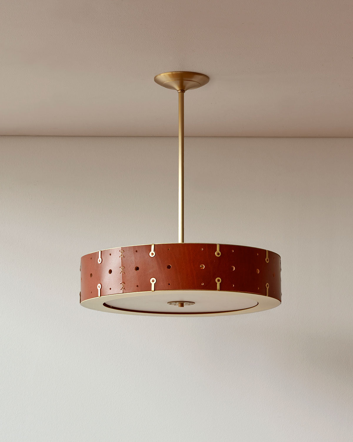 Beautiful satin brass ceiling pendant fixture with handstitched leather drum shade and customizable drop
#leather-color_tan-harness
