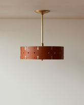 Beautiful satin brass ceiling pendant fixture with handstitched leather drum shade and customizable drop
#leather-color_tan-harness