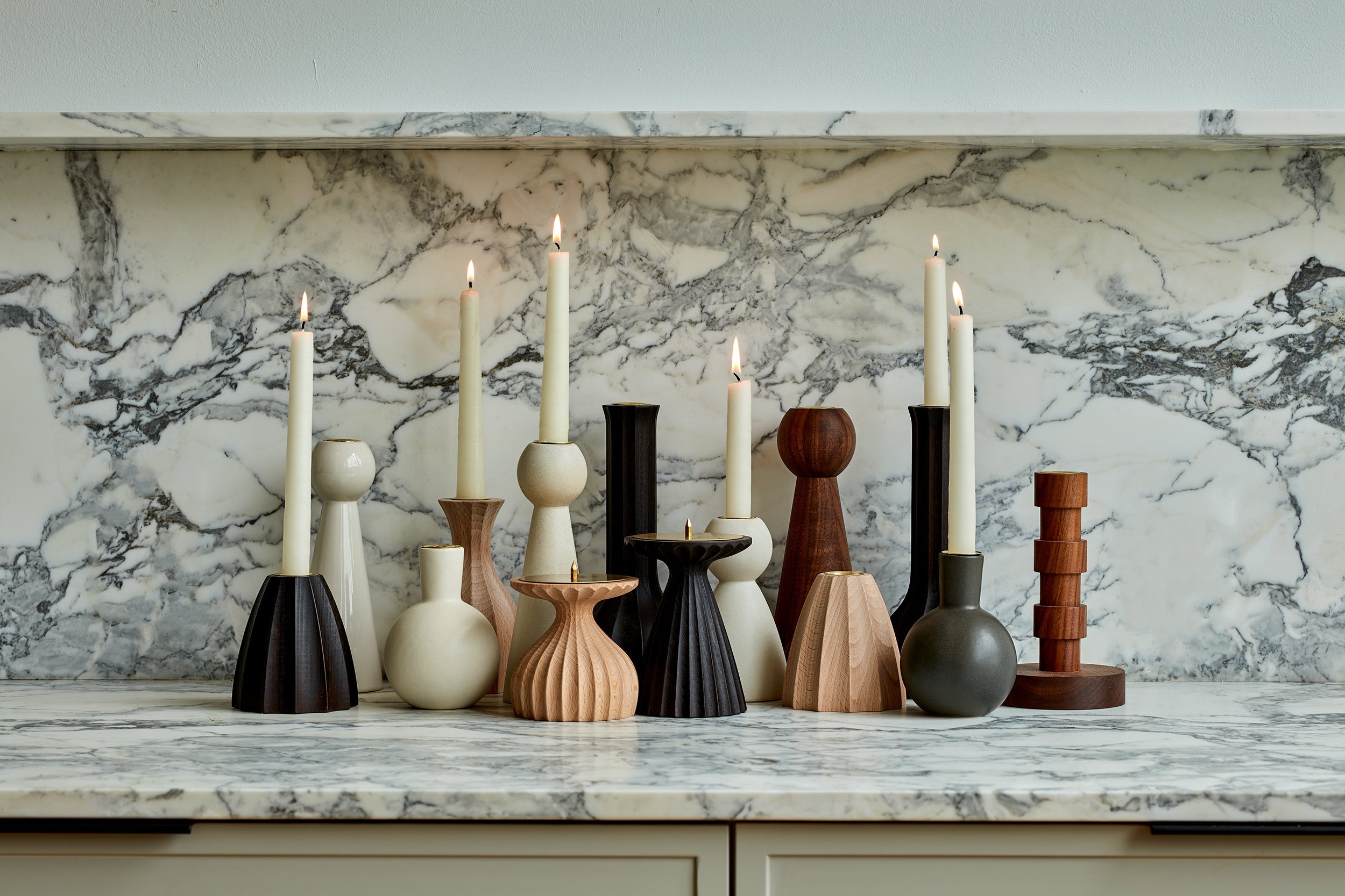 pretty wooden candle holders on a mantel 