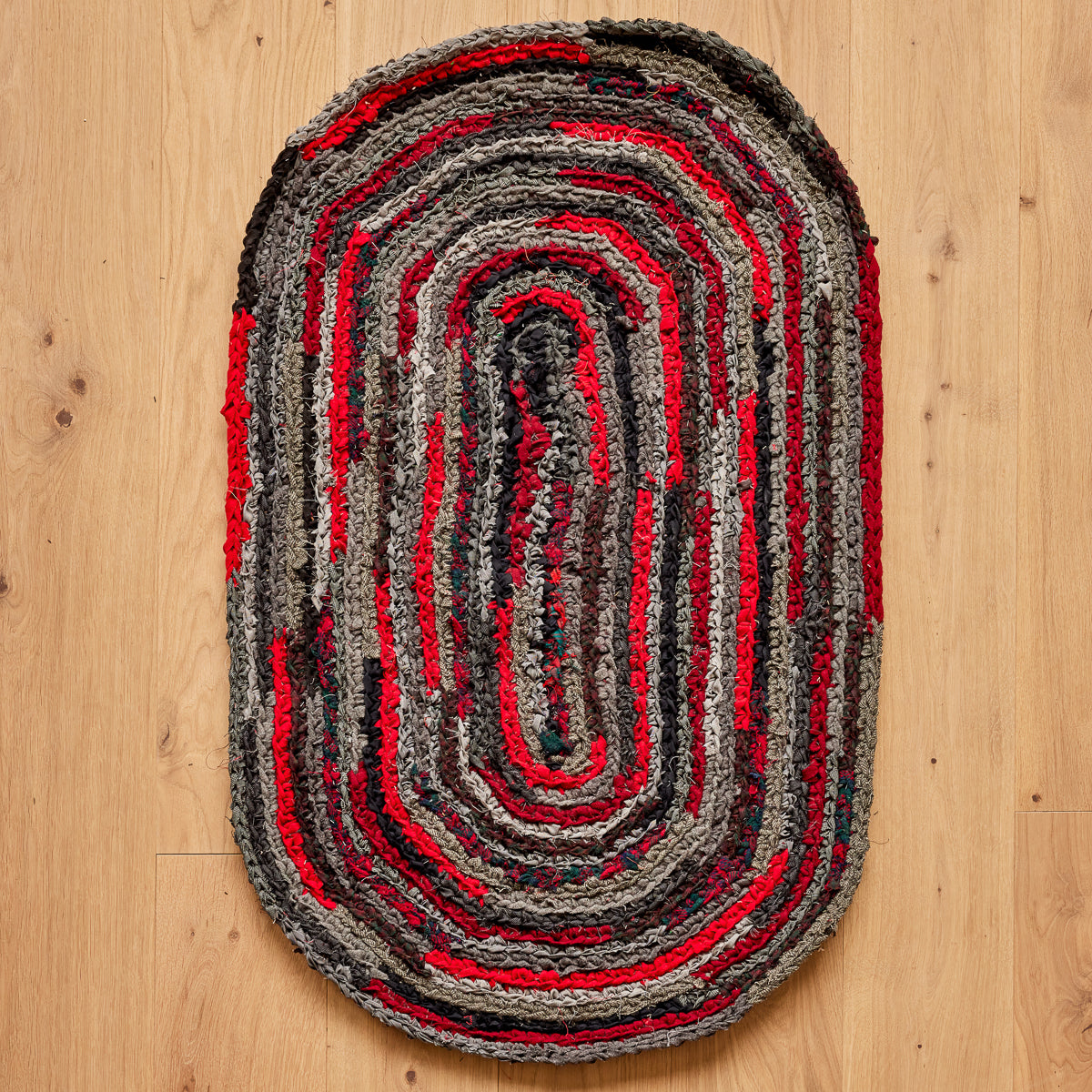 Hand Braided Oval Wool Rug 24.5” x 42” Red, Black and Tweed – CT