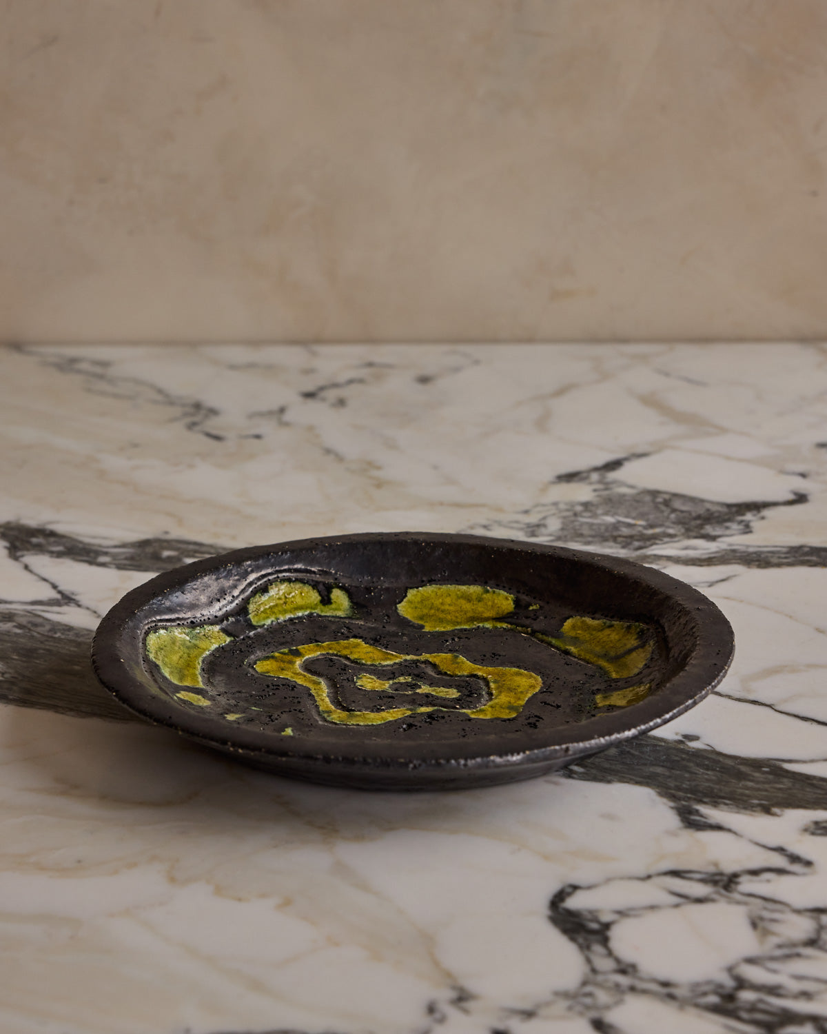 Black Ceramic Plate with Yellow Glaze