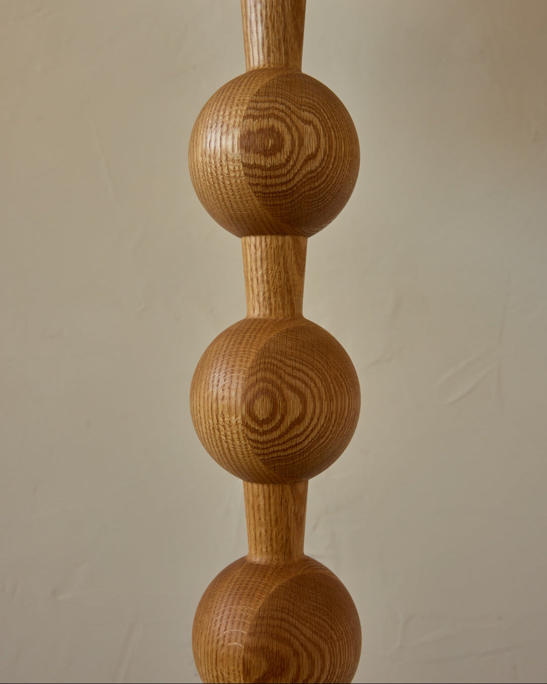 Tall sculptural solid red oak floor lamp with barbell design in natural finish with ivory linen drum shade, best seller, made in the USA 
#color_natural red oak
