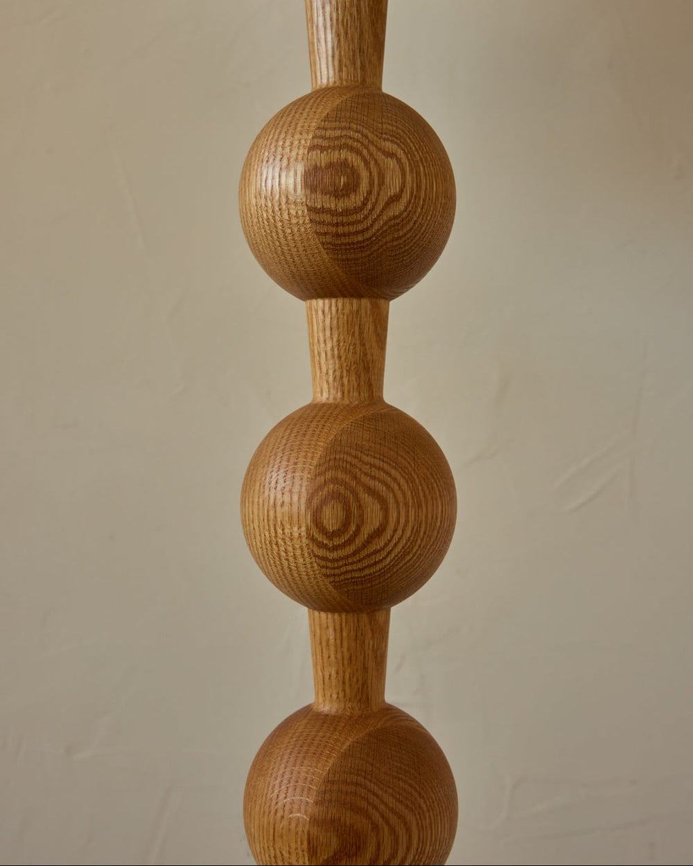 Tall sculptural solid red oak floor lamp with barbell design in natural finish with ivory linen drum shade, best seller, made in the USA 
#color_natural red oak
