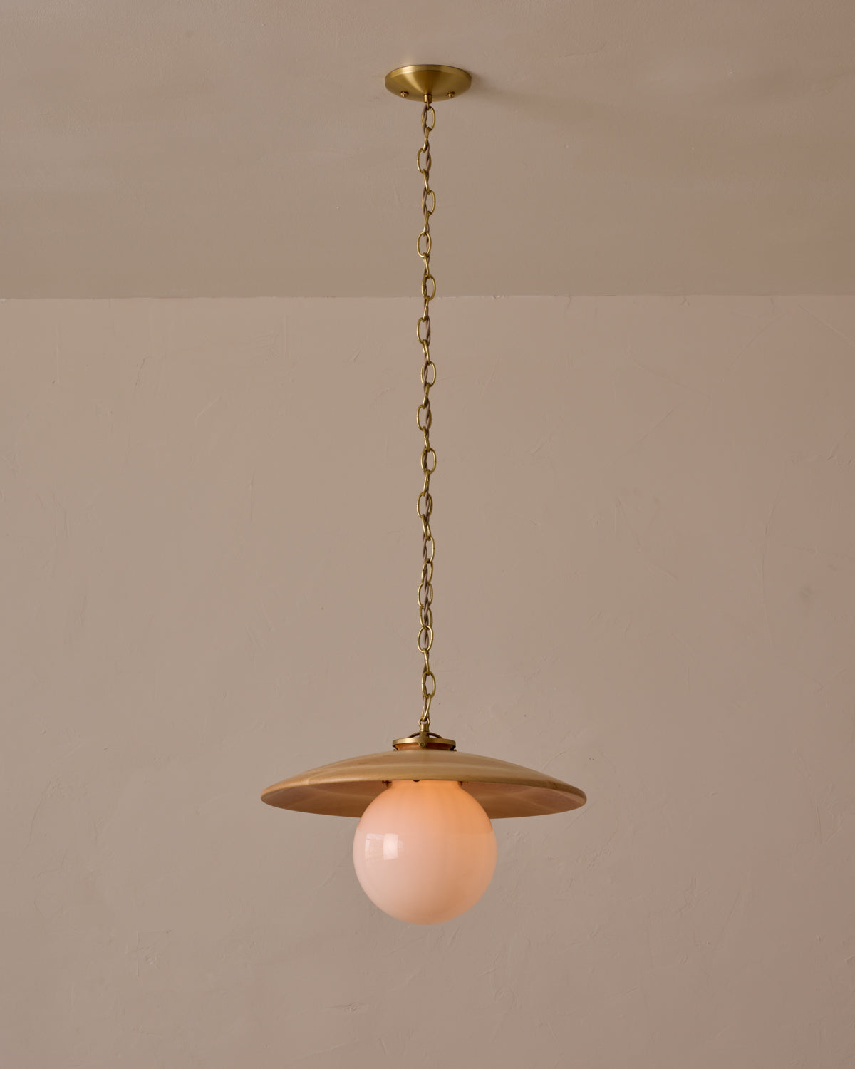 Large pendant light with oversized clear glass globe and decorative wooden clear maple shade with brass chain  #shade-finish_natural maple #globe_white glass #cord-color_beige