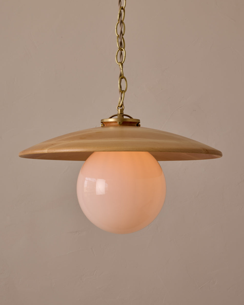 Large pendant light with oversized clear glass globe and decorative wooden clear maple shade with brass chain  #shade-finish_natural maple #globe_white glass #cord-color_beige