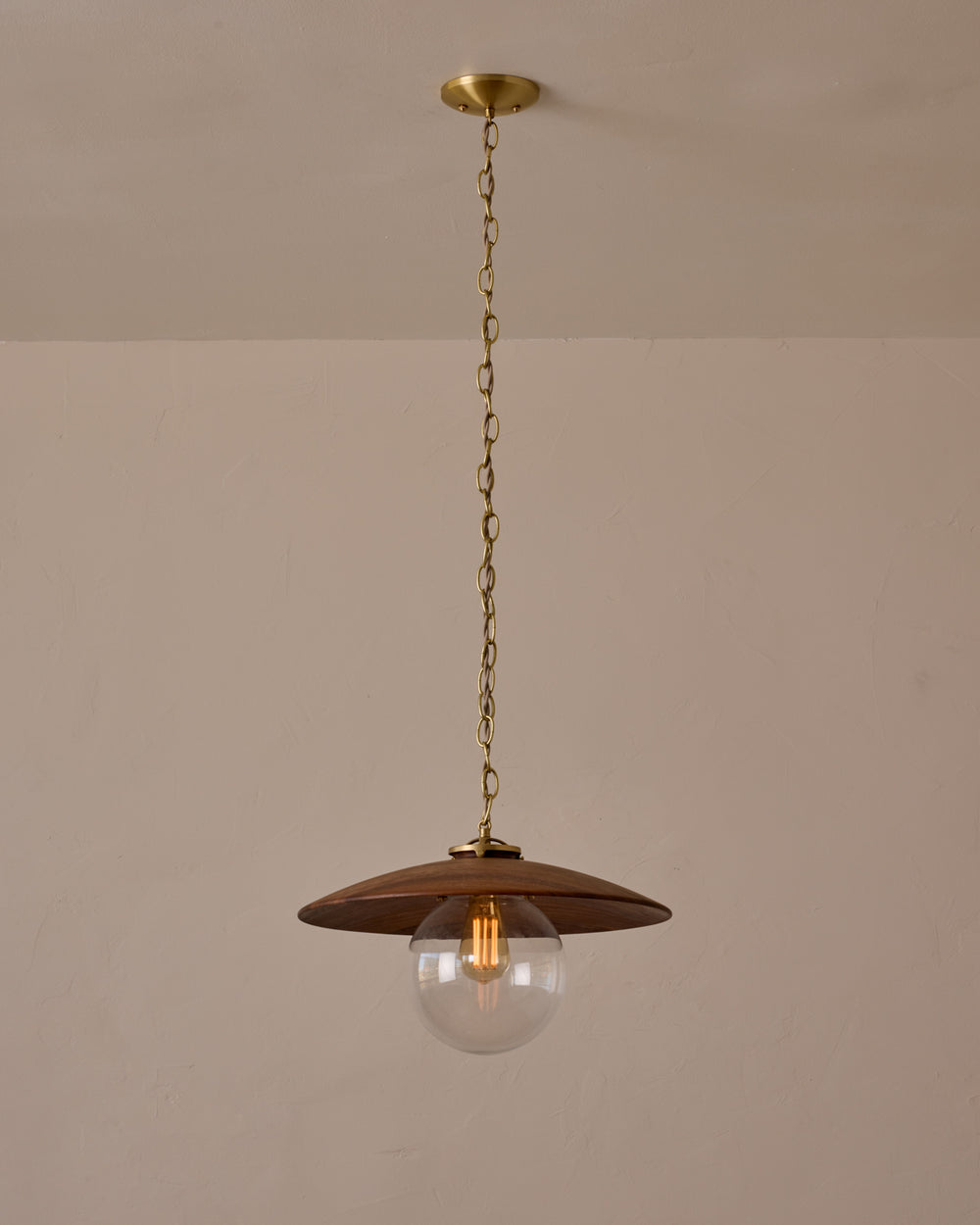 Large pendant light with oversized clear glass globe and decorative wooden clear maple shade with brass chain  #shade-finish_black walnut #globe_clear glass #cord-color_beige