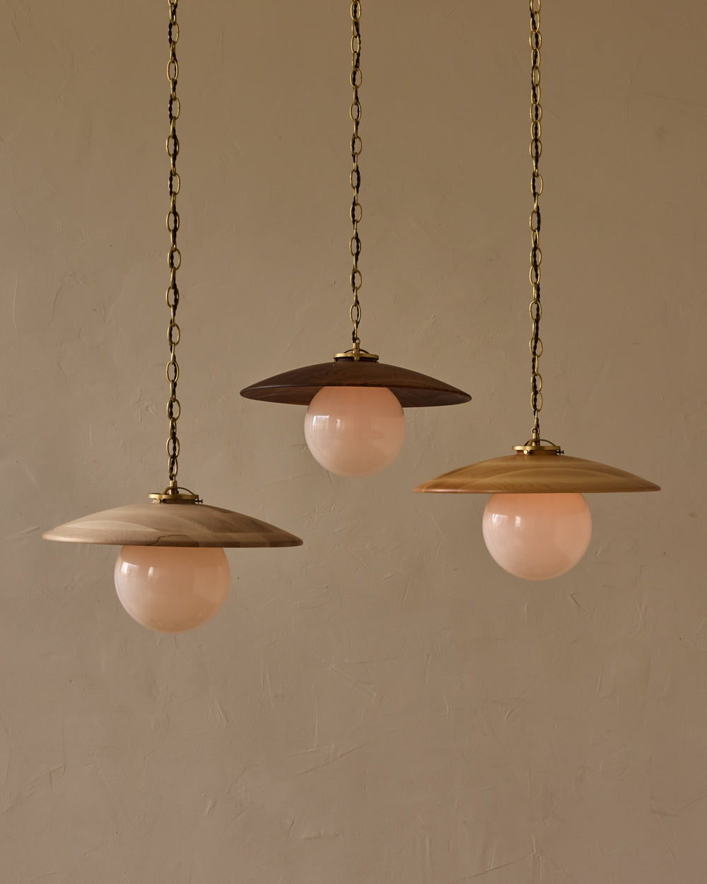 Large pendant light with oversized clear glass globe and decorative wooden clear maple shade with brass chain  #shade-finish_black walnut #globe_white glass #cord-color_brown