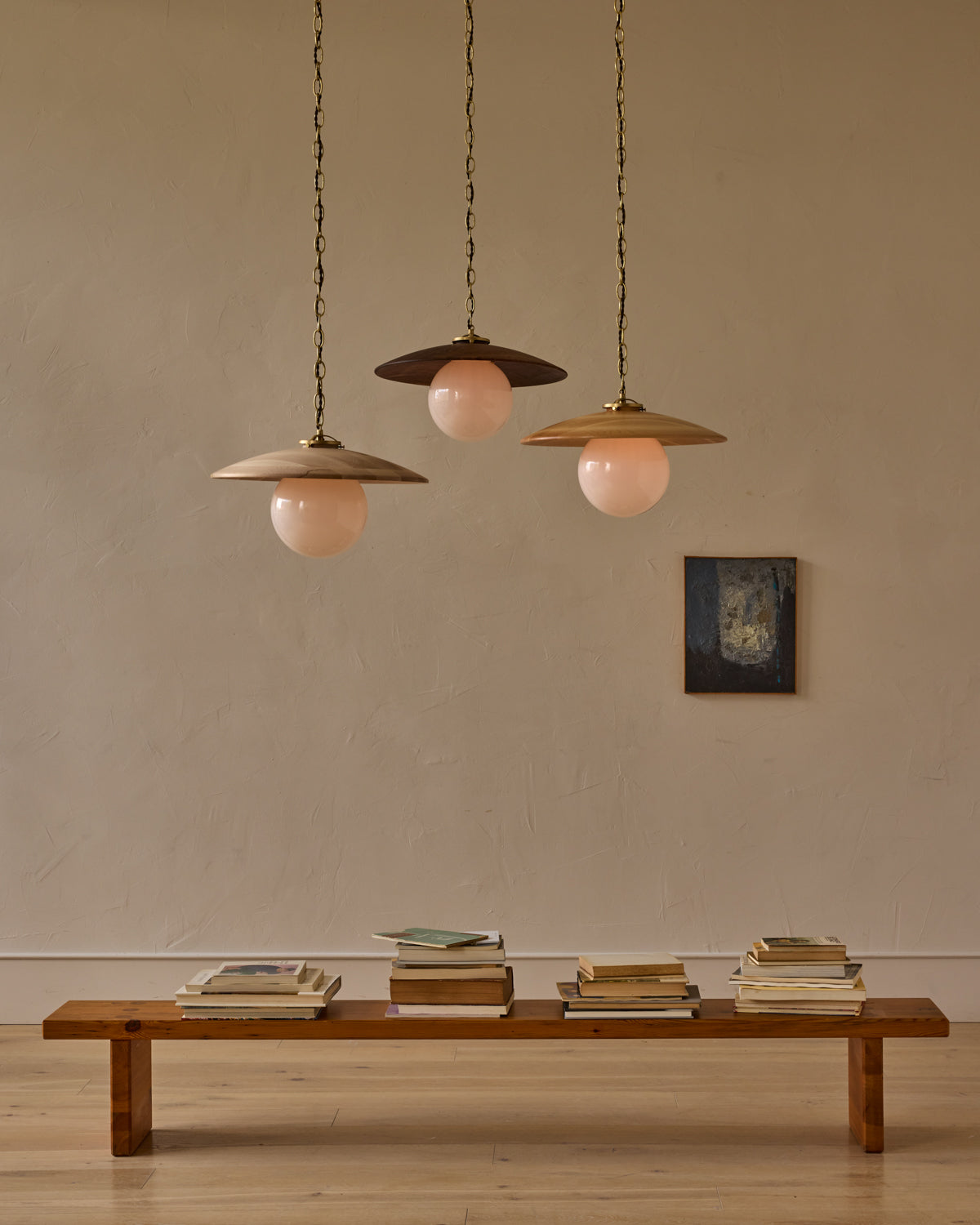 Large pendant light with oversized clear glass globe and decorative wooden clear maple shade with brass chain  #shade-finish_natural maple #globe_white glass #cord-color_brown