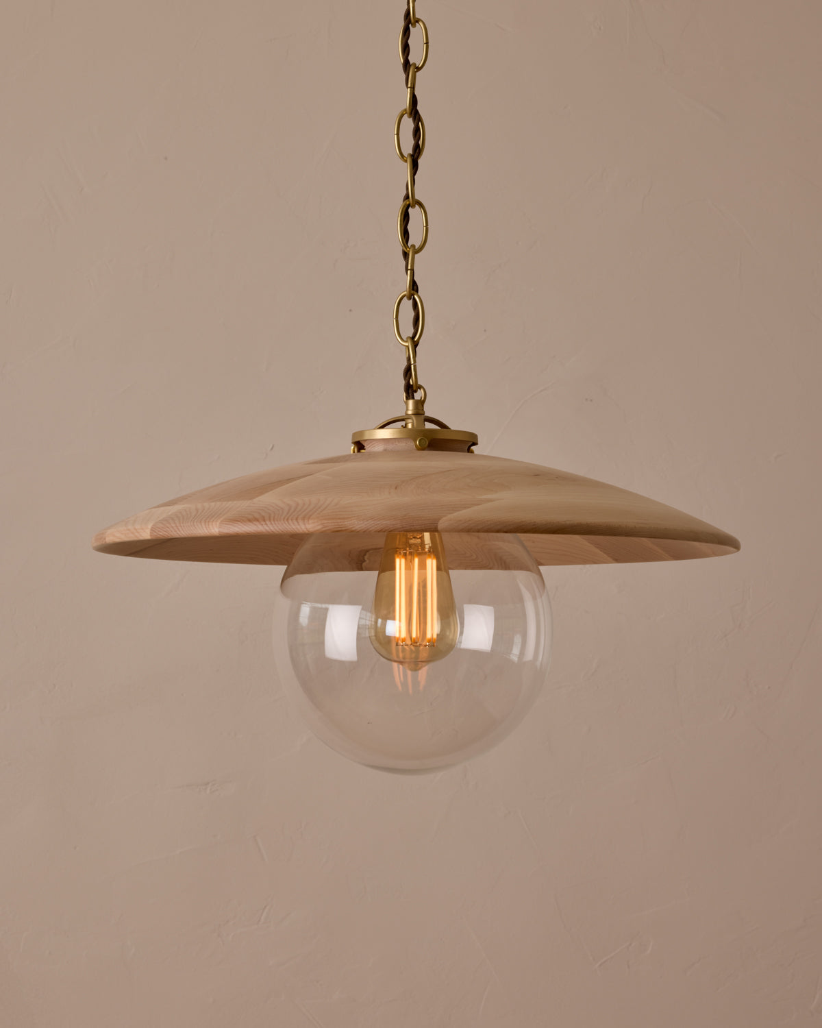 Large pendant light with oversized clear glass globe and decorative wooden clear maple shade with brass chain #shade-finish_clear maple