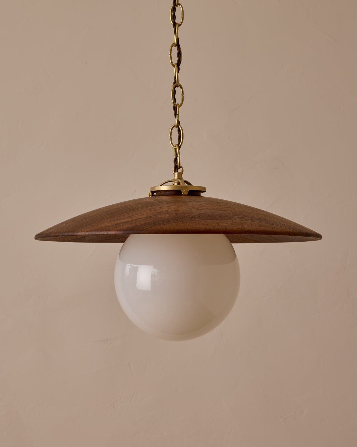 Large pendant light with oversized clear glass globe and decorative wooden clear maple shade with brass chain  #shade-finish_black walnut #globe_white glass #cord-color_brown