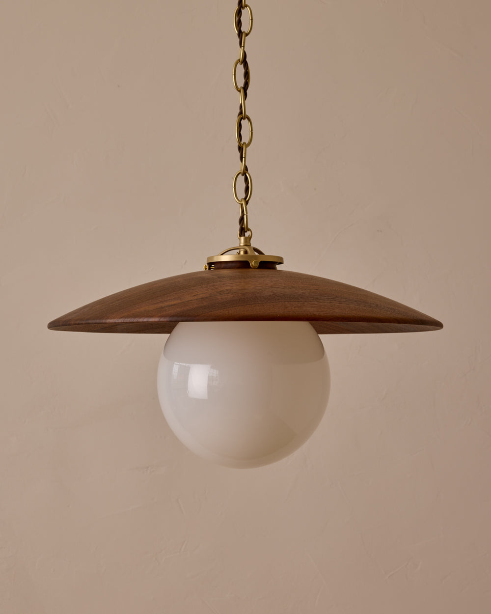 Large pendant light with oversized clear glass globe and decorative wooden clear maple shade with brass chain  #shade-finish_black walnut #globe_white glass #cord-color_brown