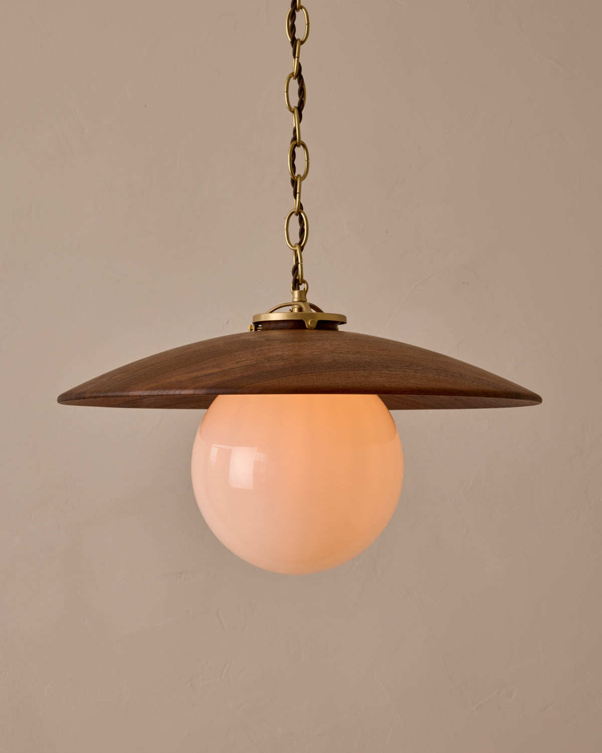 Large pendant light with oversized clear glass globe and decorative wooden clear maple shade with brass chain  #shade-finish_black walnut #globe_white glass #cord-color_brown