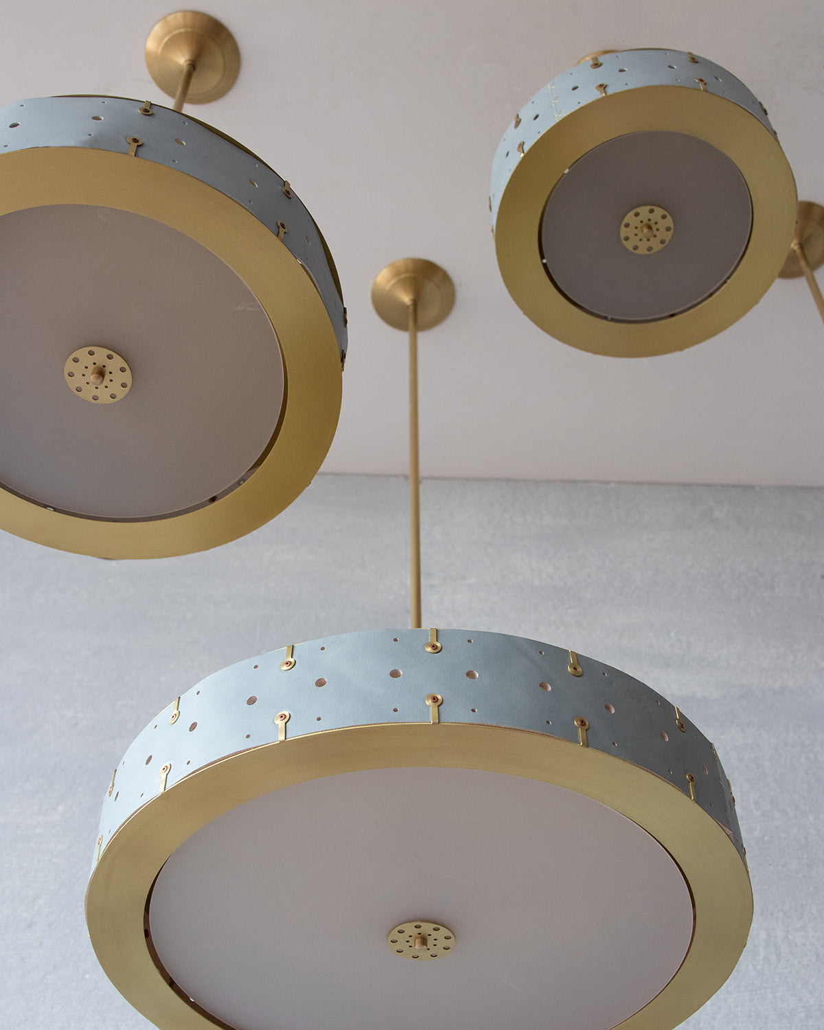 Beautiful satin brass ceiling pendant fixture with handstitched leather drum shade and customizable drop
#leather-color_cloud blue