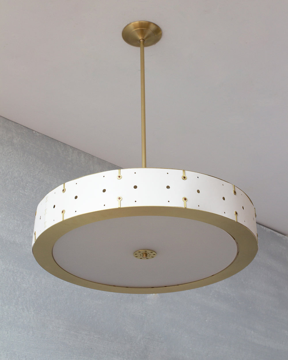 Beautiful satin brass ceiling pendant fixture with handstitched leather drum shade and customizable drop
#leather-color_dogwood