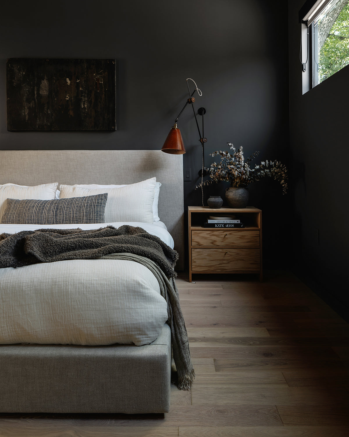 Large articulating black plug in wall sconce with tan handstitched cone leather shade in bedroom as bedside sconce#shade-finish_tan harness #wiring_plug-in