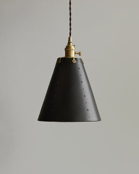 Black leather cone pendant with handstitched, perforated leather shade. Made by Lostine in Philadelphia. Hardwired or plug light fixture. Simple interior design, made in the USA.