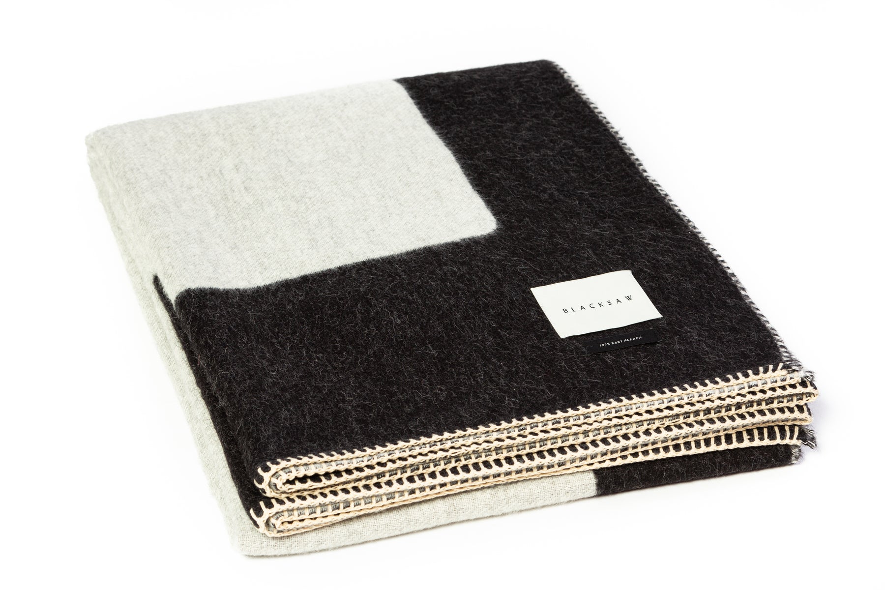 Soft baby alpaca reversible blanket with black and white rectangles
