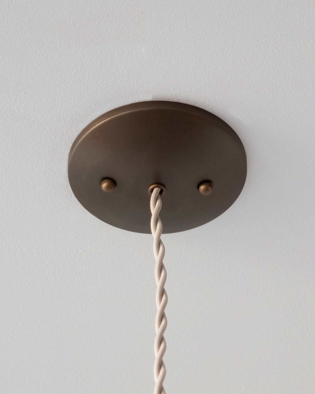 Modern mirrored cone pendants with oil rubbed brass. Hardwired light fixture. Simple interior design, made in the USA. #size_10" cone