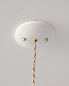 Glossy white canopy for Charming leather pendant light with blue handstitched shade and brass accents