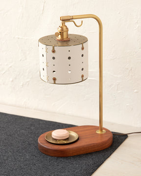 Charming desk lamp with white handstitched articulating leather shade, warm brass and walnut wood with brass dish