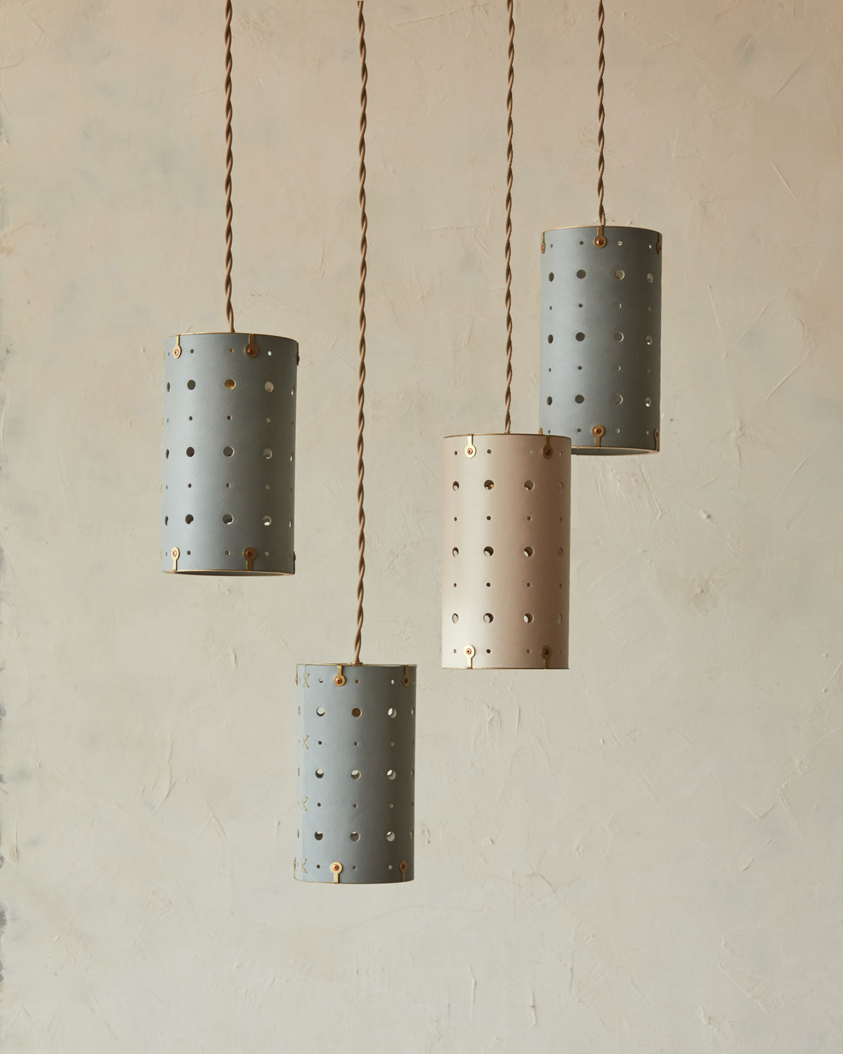 Charming leather pendant light with handstitched shade and brass accents