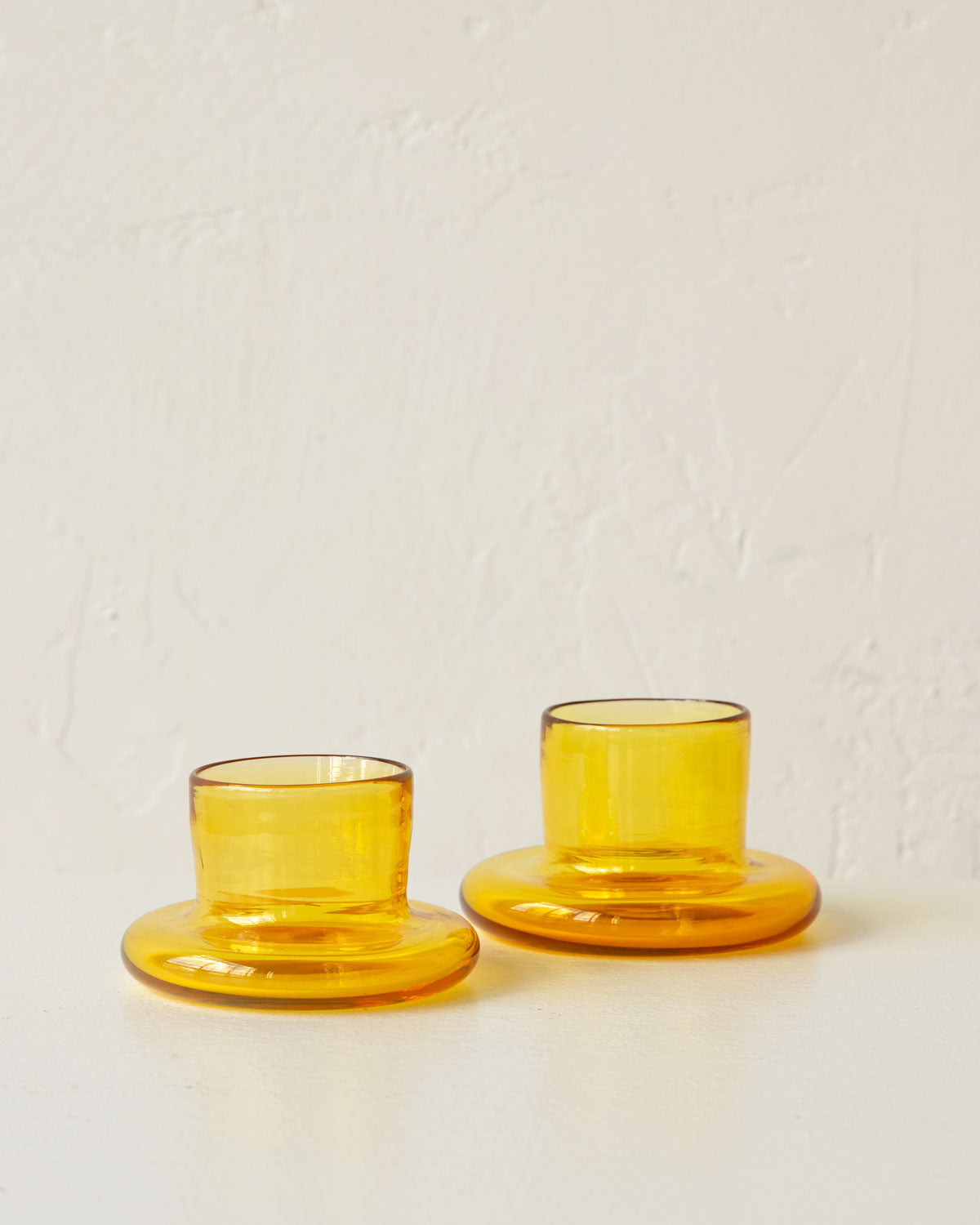 Pair of handmade yellow glass tea light holders